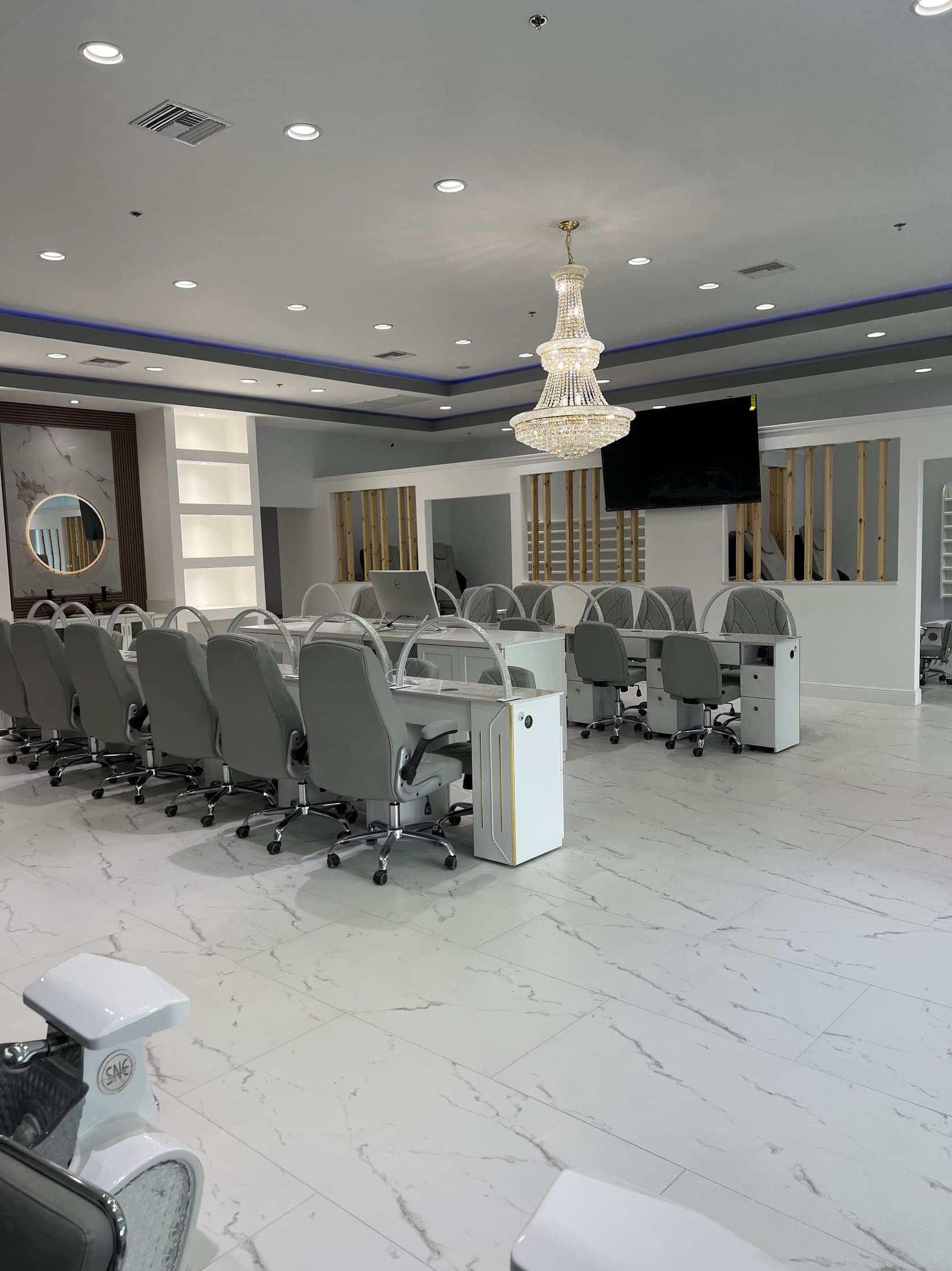 Manicure stations with crystal chandelier at Blue Nails & Spa, Tallahassee, FL 32303