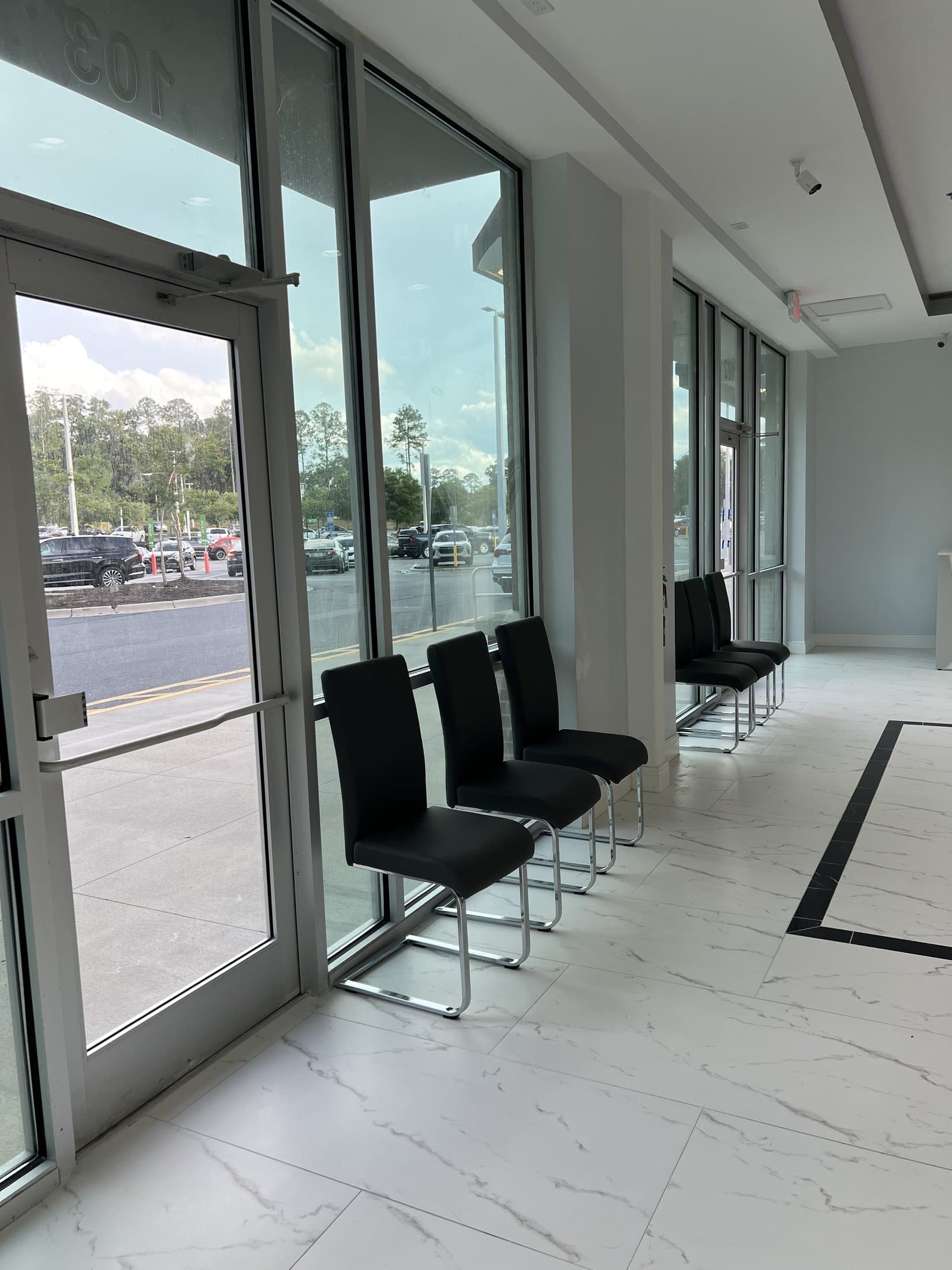 Waiting area seating near the entrance at Blue Nails & Spa on Capital Circle NW, Tallahassee