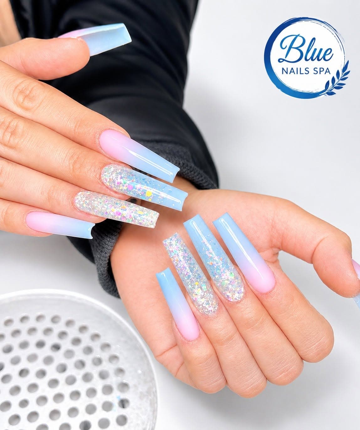 Pink-to-blue ombre coffin nails with iridescent glitter accent nails by Blue Nails & Spa, Tallahassee, FL