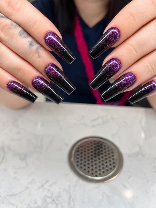 Black and purple glitter ombre coffin nails by Blue Nails & Spa, Tallahassee, FL