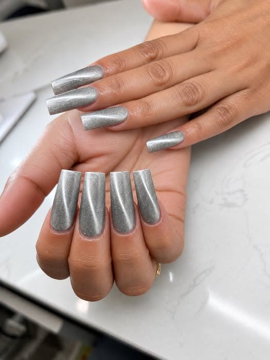 Silver chrome coffin-shaped acrylic nails by Blue Nails & Spa, Tallahassee, FL